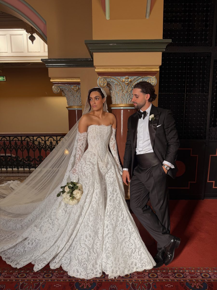 Bride and groom in a heritage hall