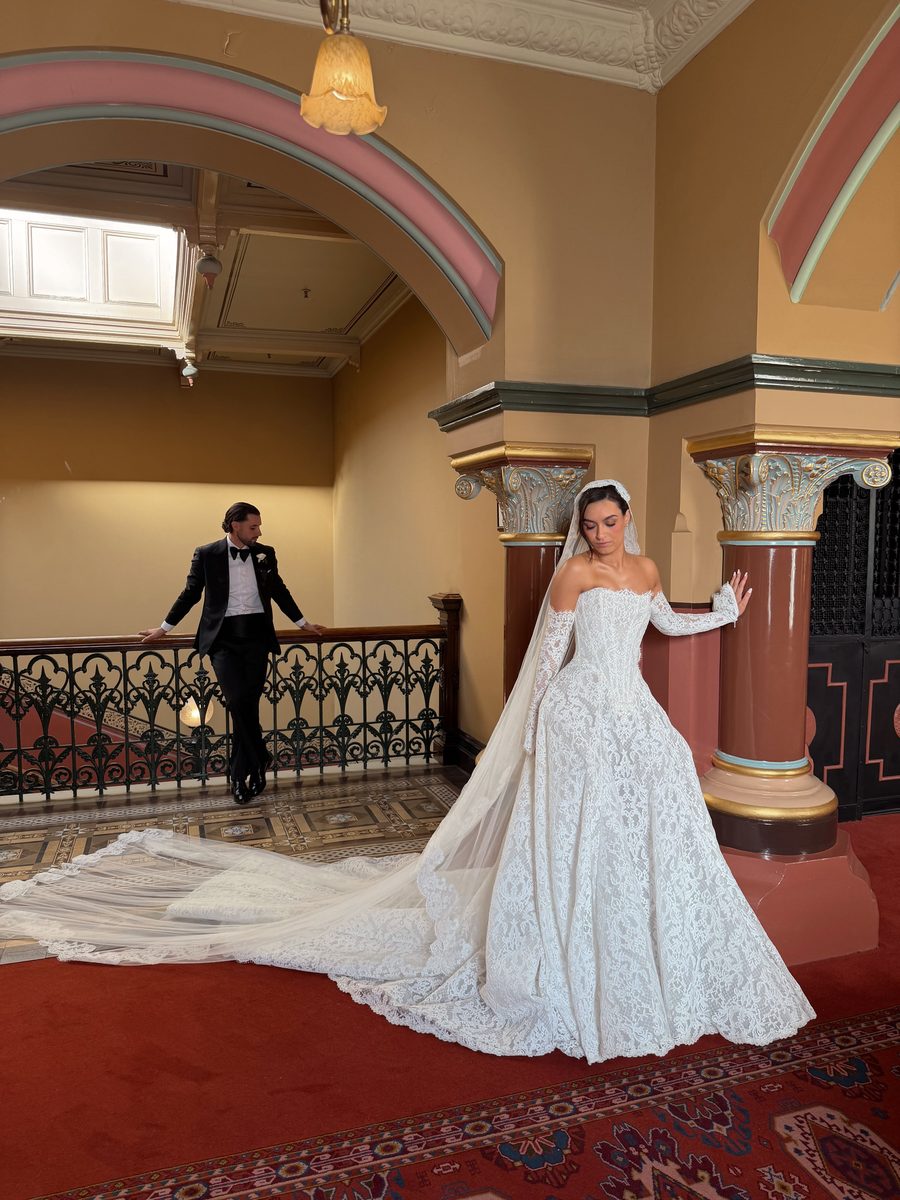 Bride in a long veil in the hallway