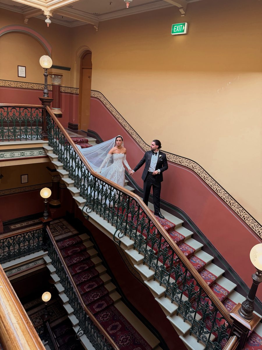 Couple on a grand staircase
