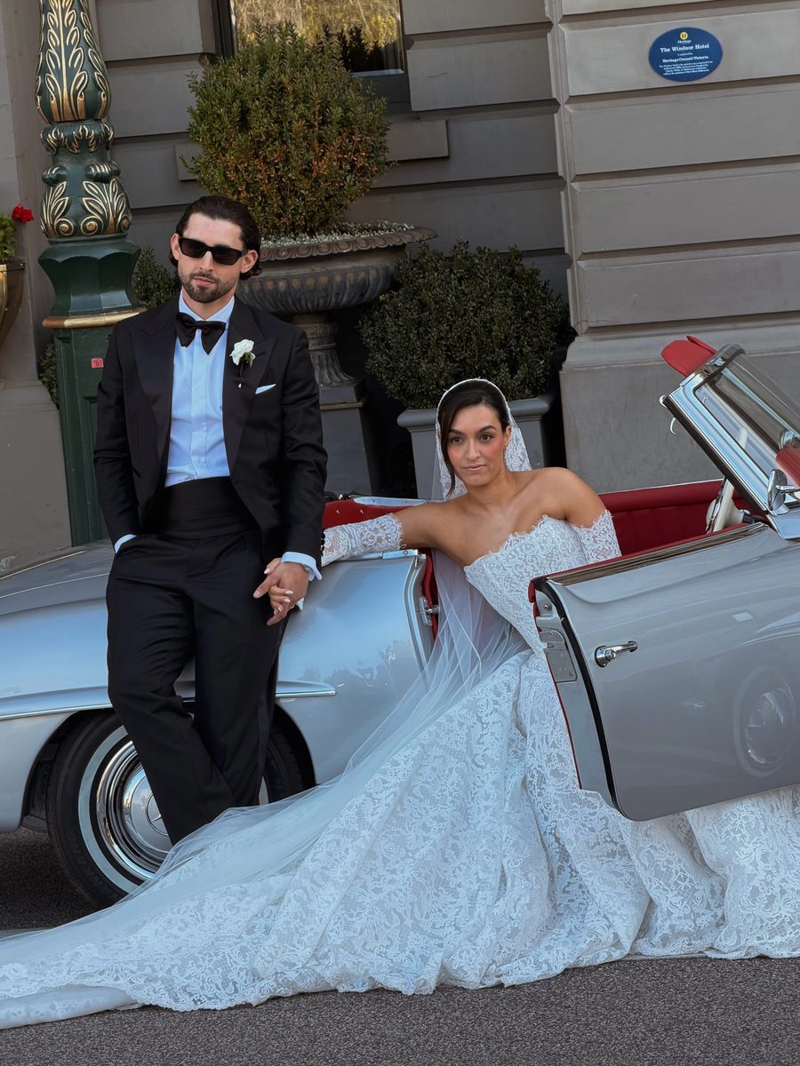 Couple with a vintage convertible