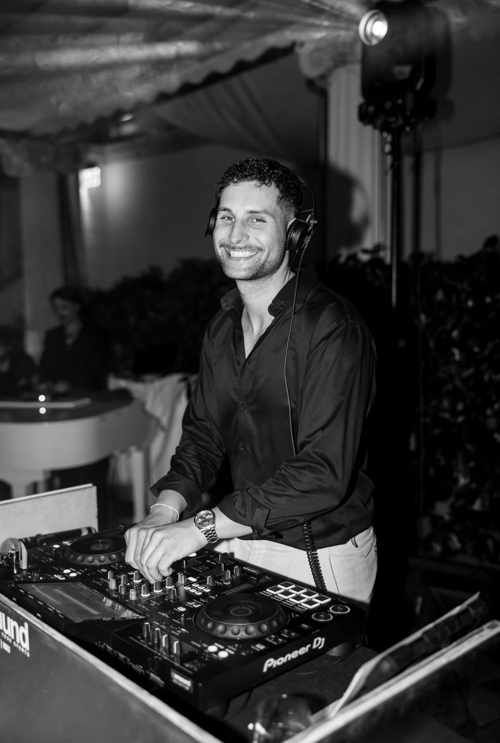 Adrian smiling behind the decks in Sorrento