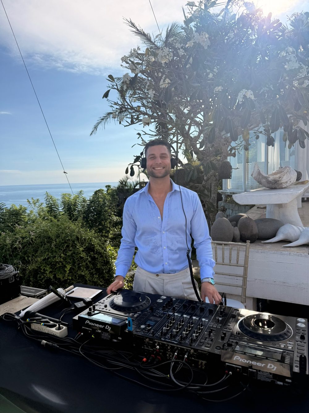 Adrian on the decks overlooking the ocean in Bali
