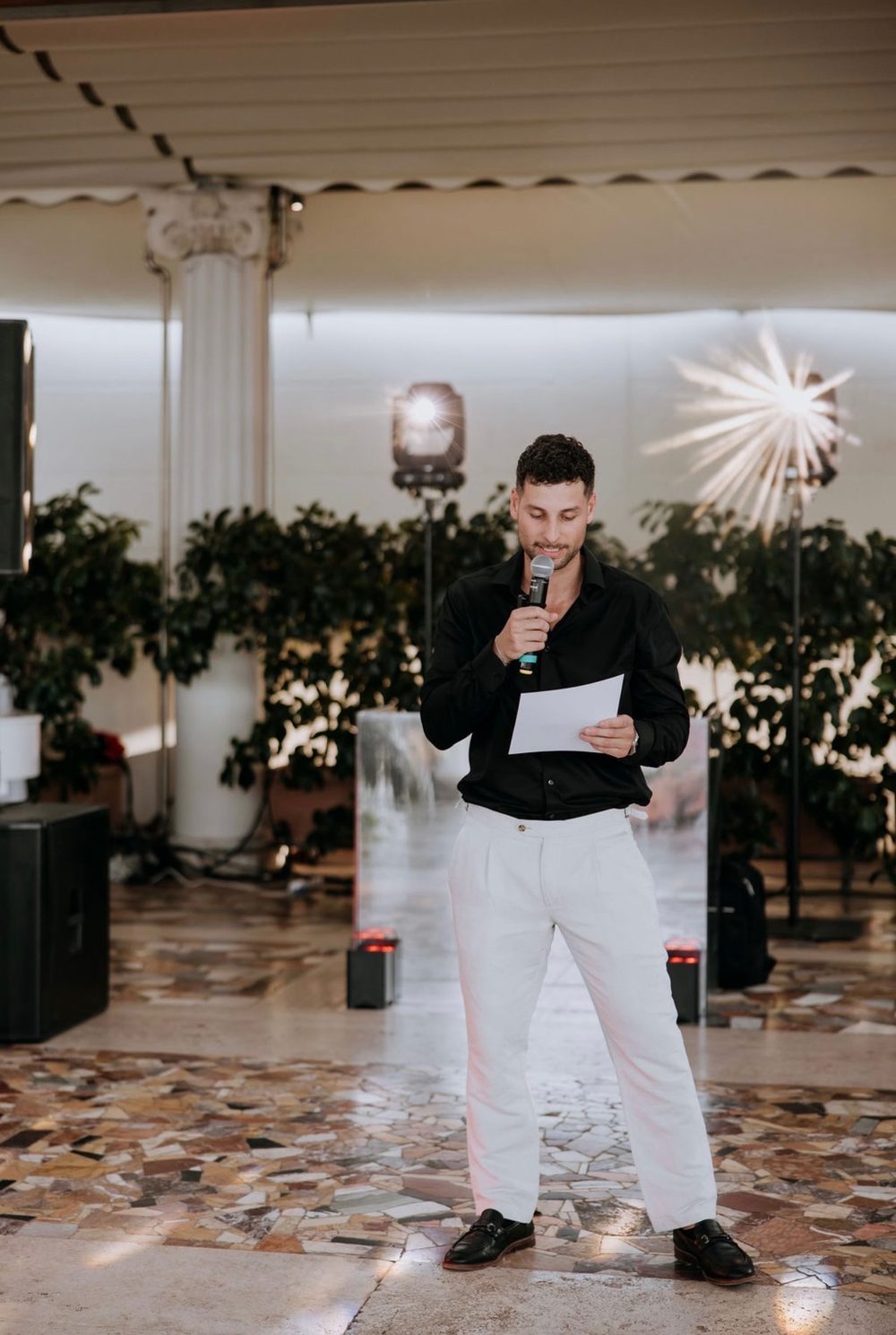 Adrian on the microphone at a reception in Sorrento