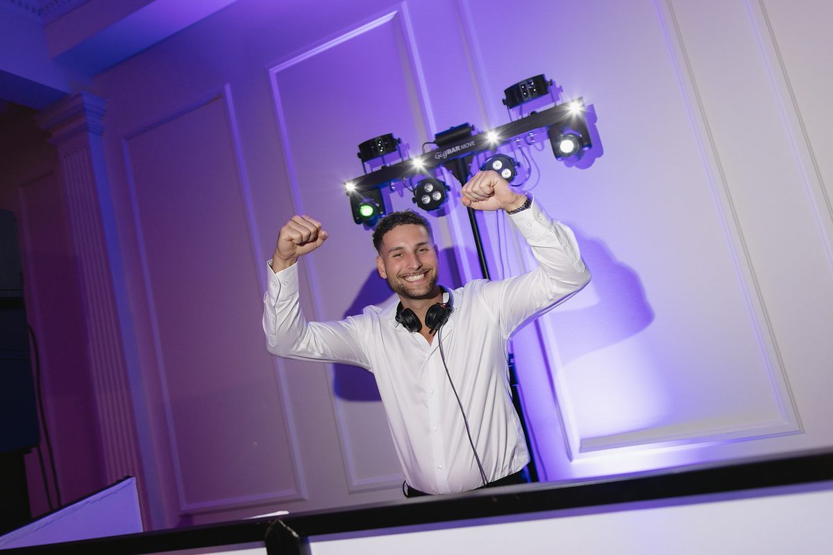 Adrian celebrating at the DJ booth
