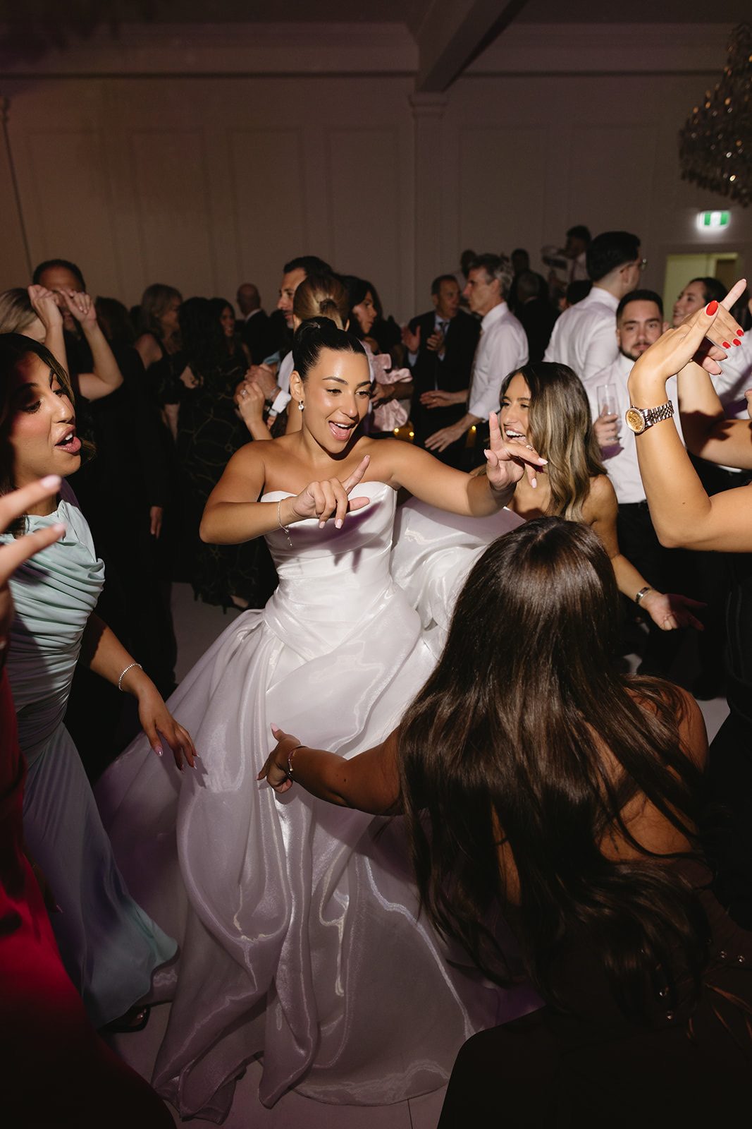 Bride dancing with friends