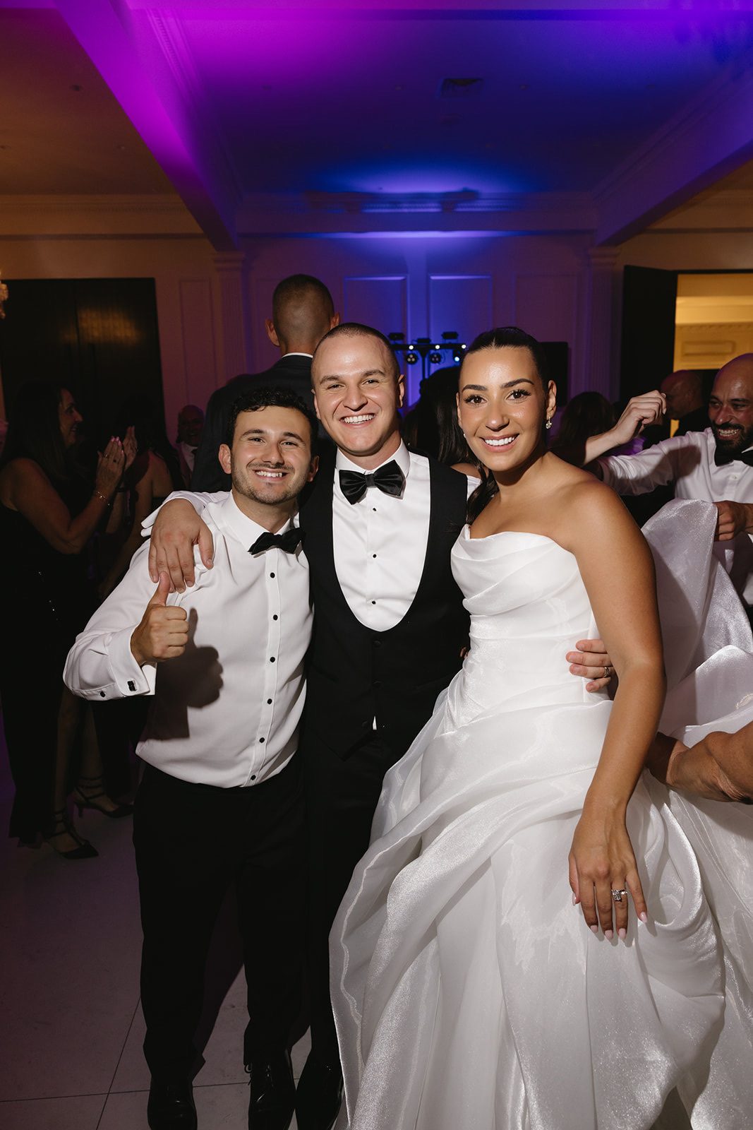 Frank with the bride and groom on the dance floor